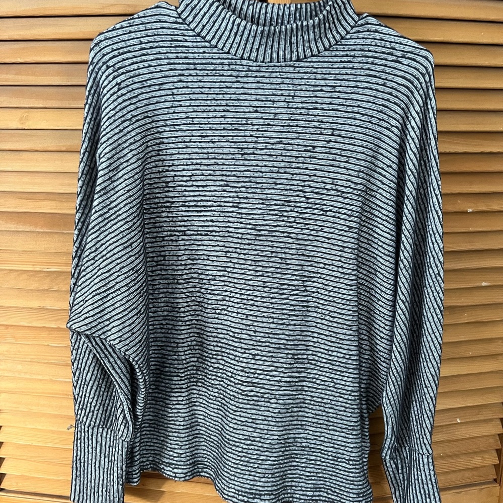Striped out from under sweater